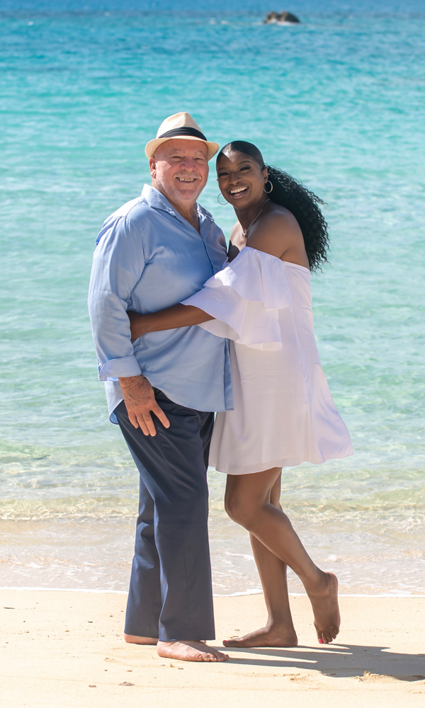 Lisza and Oliver hugging on beach
